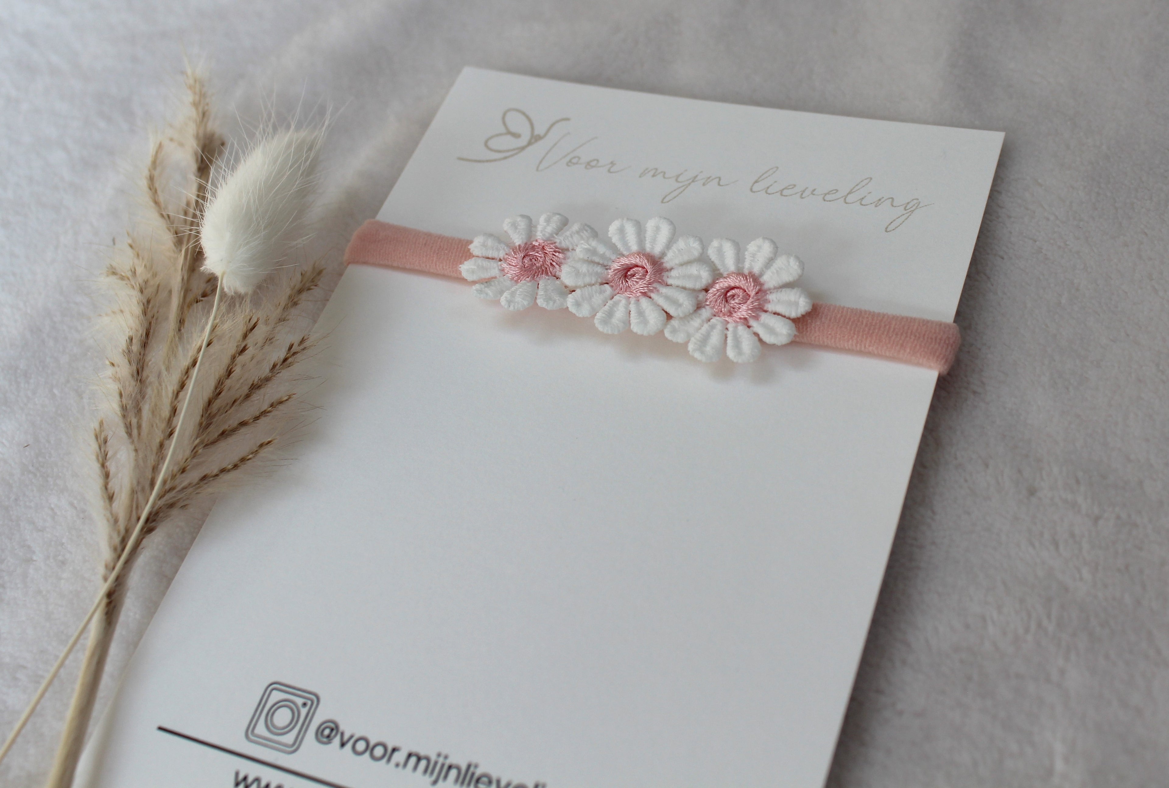 Baby haarbandje "Madelief Roze"